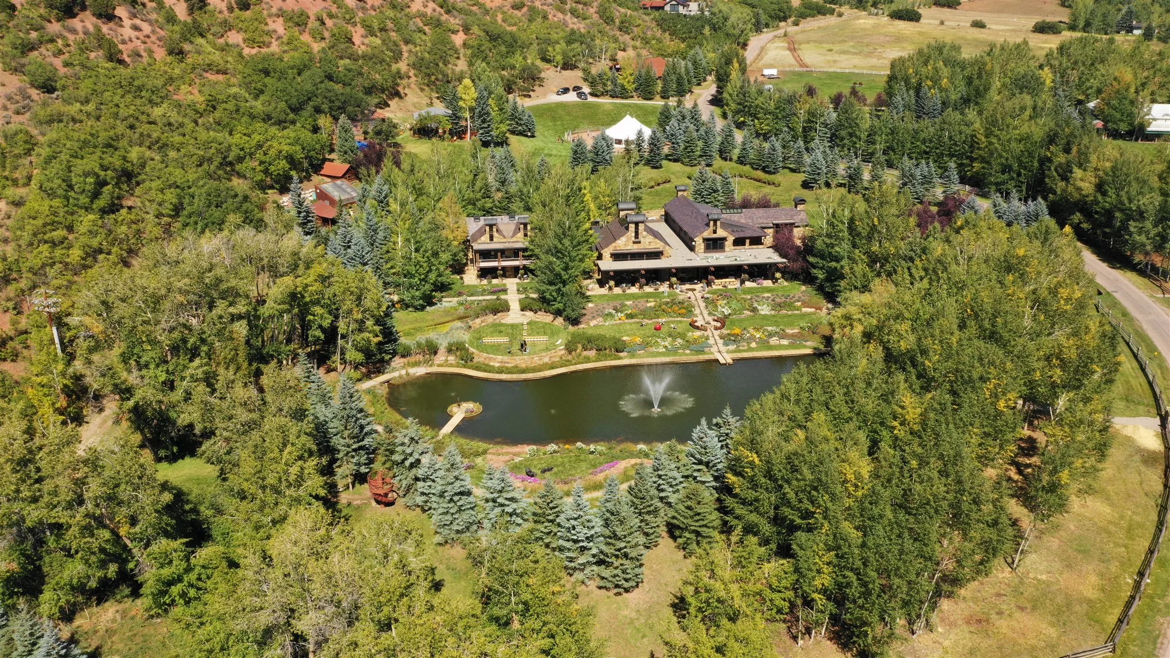 Aerial view of Fox Pond with its fountain, the gardens and the main house