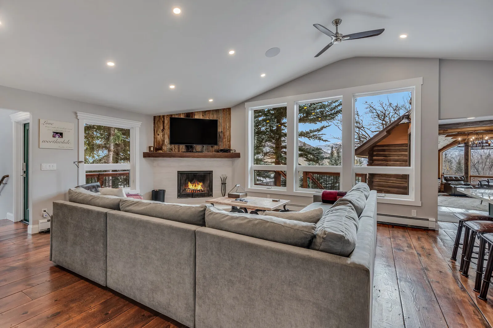 The great room with the fireplace lit